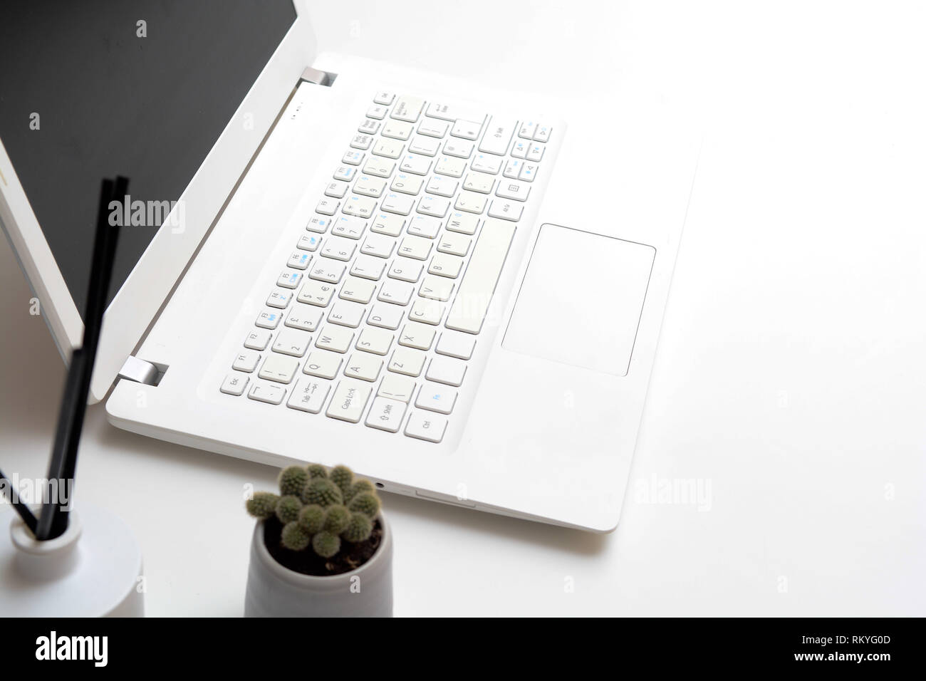 Laptop computer on modern office desk with blank screen Stock Photo - Alamy