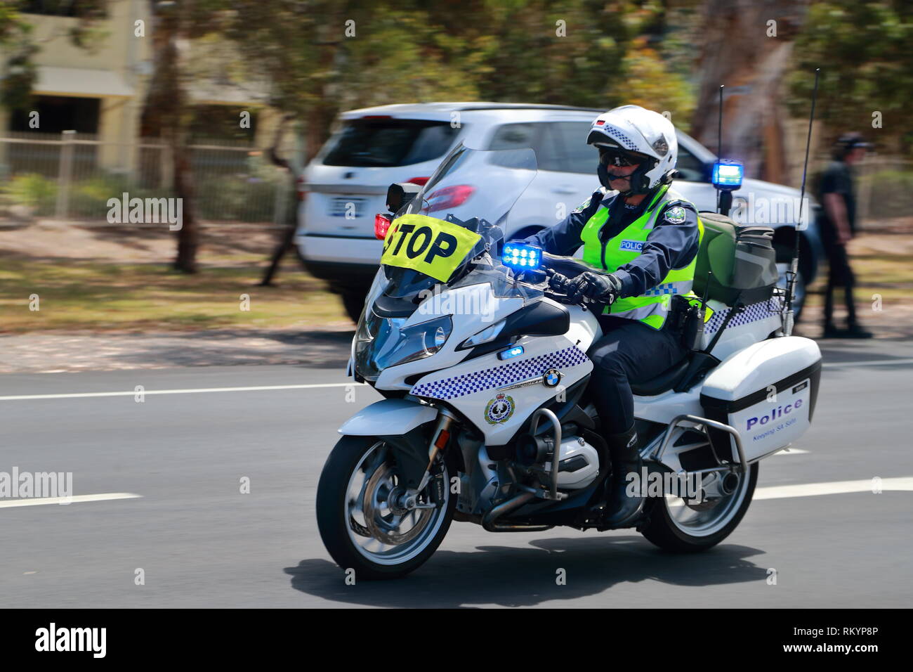 A policeman riding a motorbike during the Tour Down Under cycle