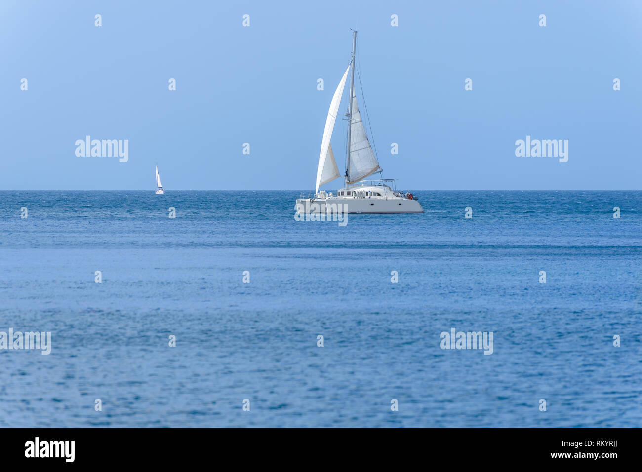 White sailing yacht sailing in the sea Stock Photo