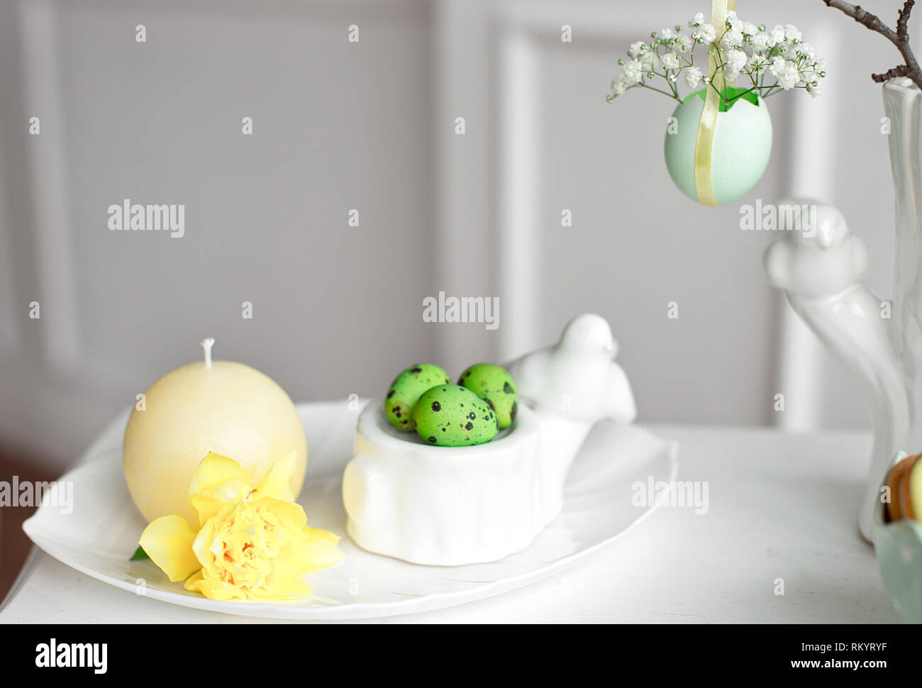 Happy Easter. Congratulatory easter background. Easter eggs and flowers. Stock Photo
