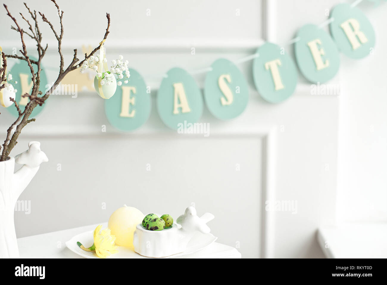 Happy Easter. Congratulatory easter background. Easter eggs and flowers. Stock Photo