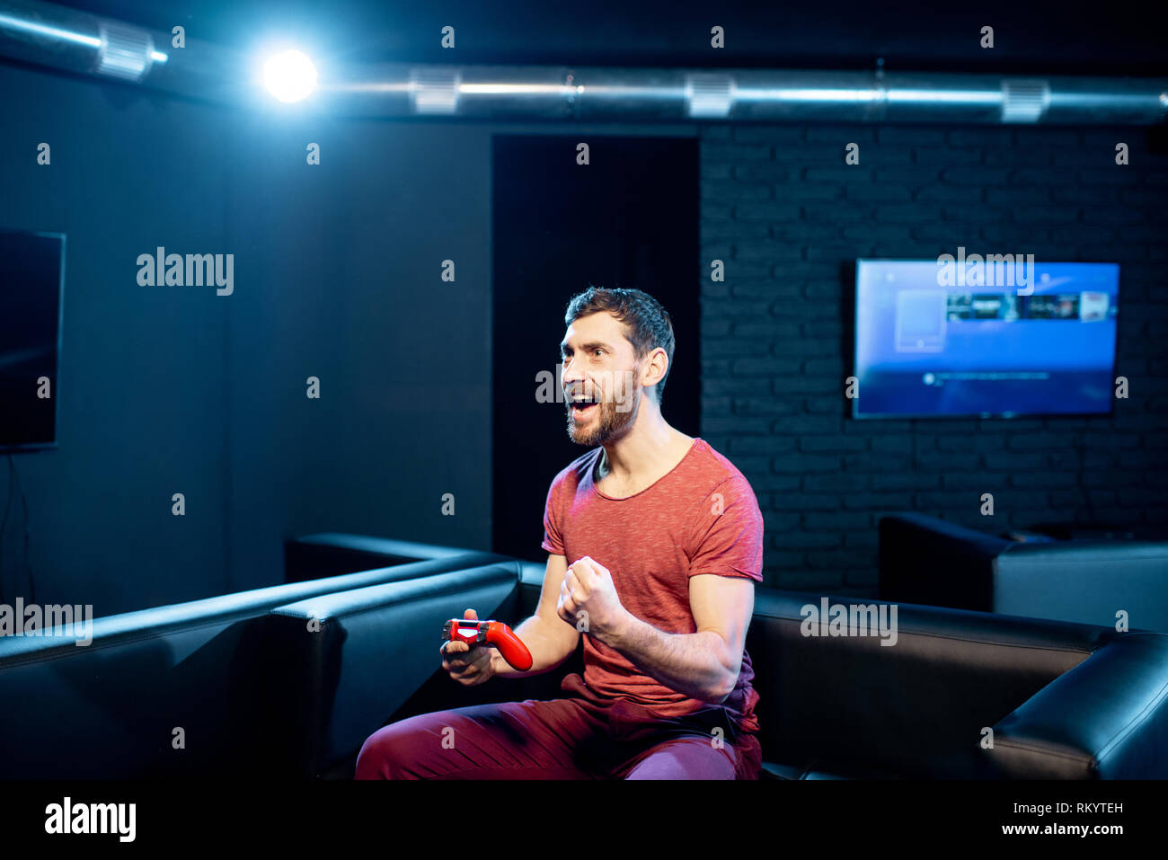 Happy Man Winning In Video Game Playing With Gaming Console