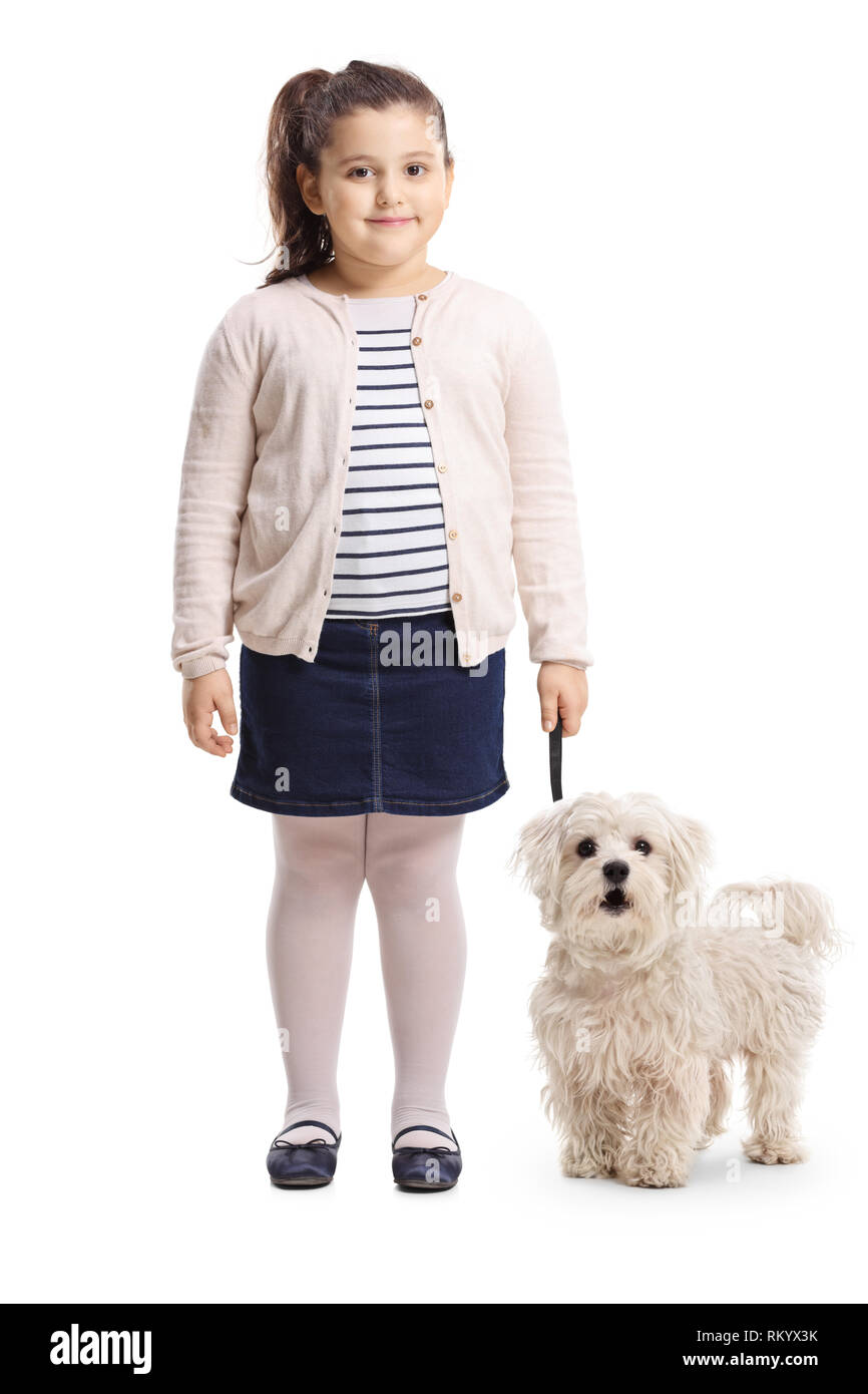 Full length portrait of a little girl with her dog smiling at the ...