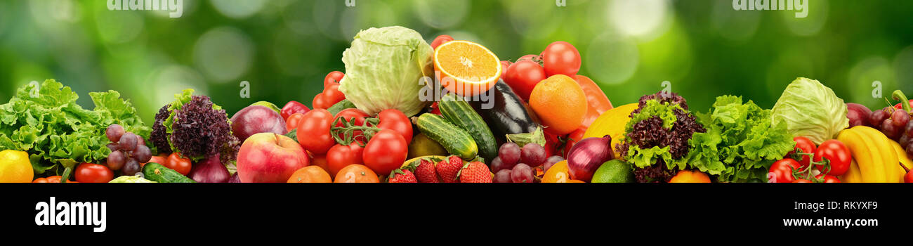 Collage natural vegetables and fruits on dark green blurred background Stock Photo