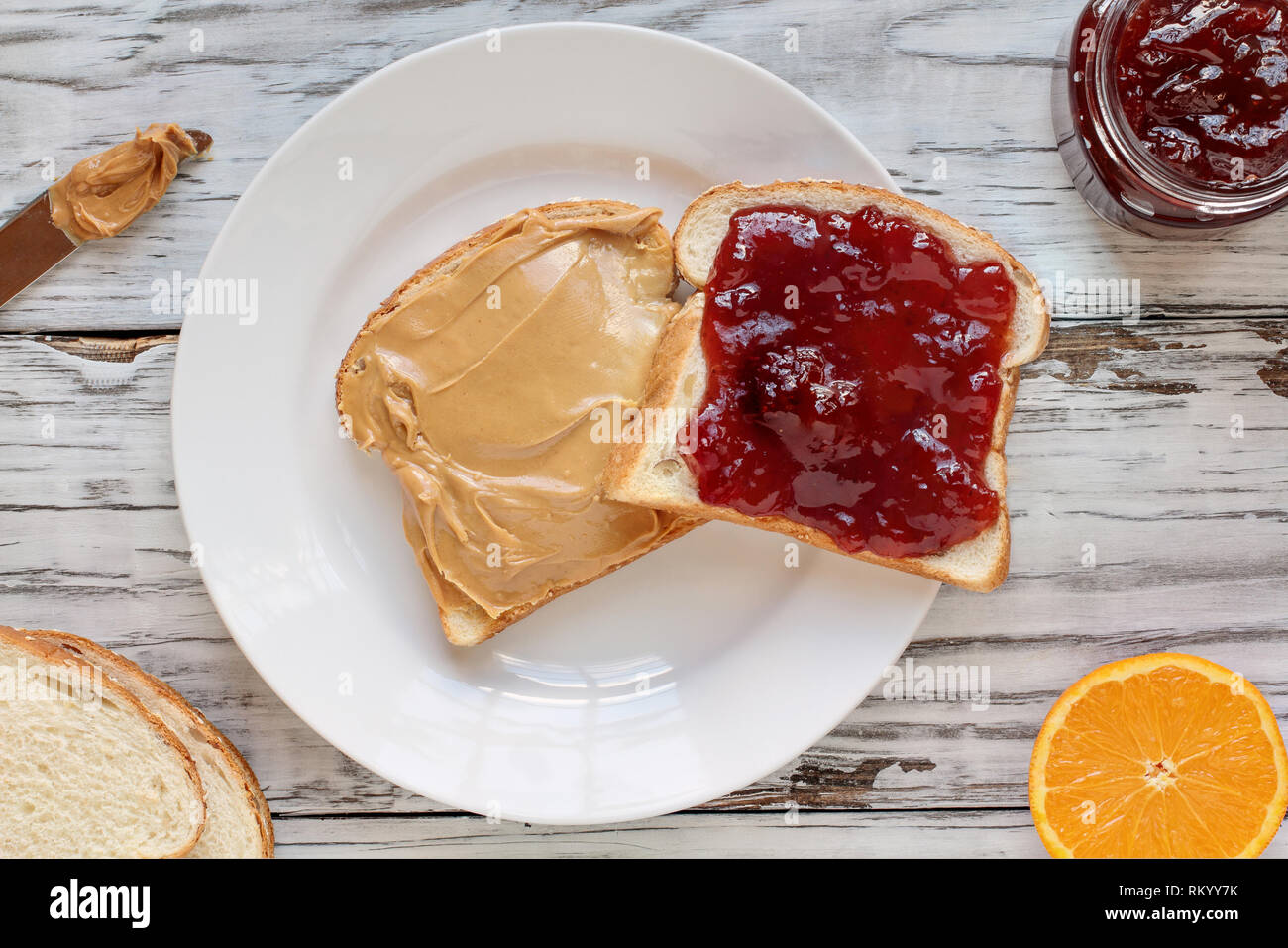 Top View Of Open Face Homemade Peanut Butter And Strawberry Jelly Sandwich On Oat Bread Over A White Rustic Wooden Table Background Served With Fr Stock Photo Alamy