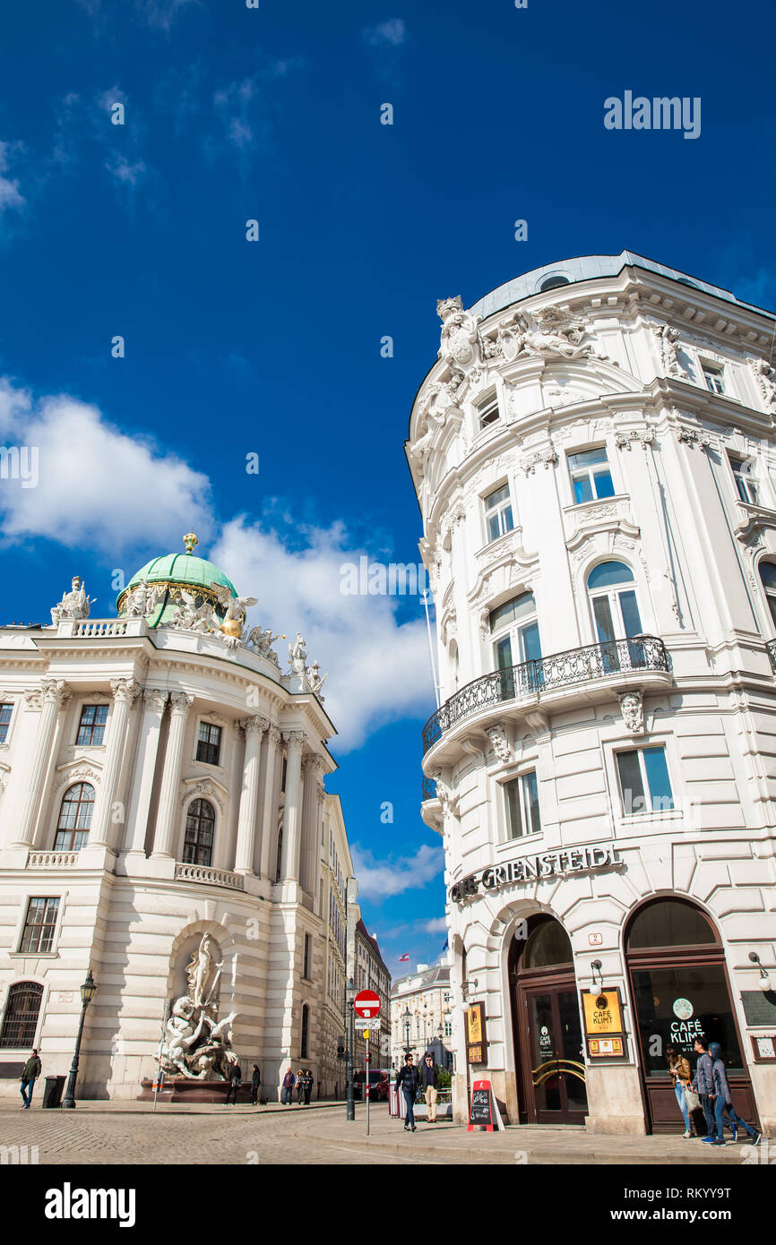 VIENNA, AUSTRIA - APRIL, 2018: Beautiful architecture of the antique buildings at Michaelerplatz next to the Hofburg at Vienna inner city Stock Photo