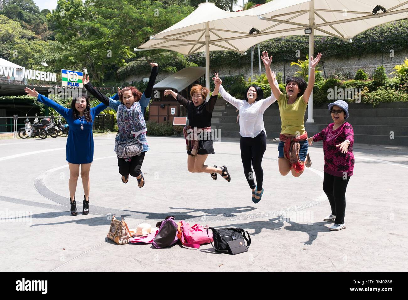 Girls jumping at Penang Hill, Malaysia Stock Photo Alamy