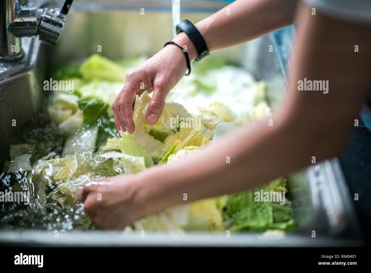 Cleaning vegetables with water, Kuching, Sarawak, Malaysia Stock Photo