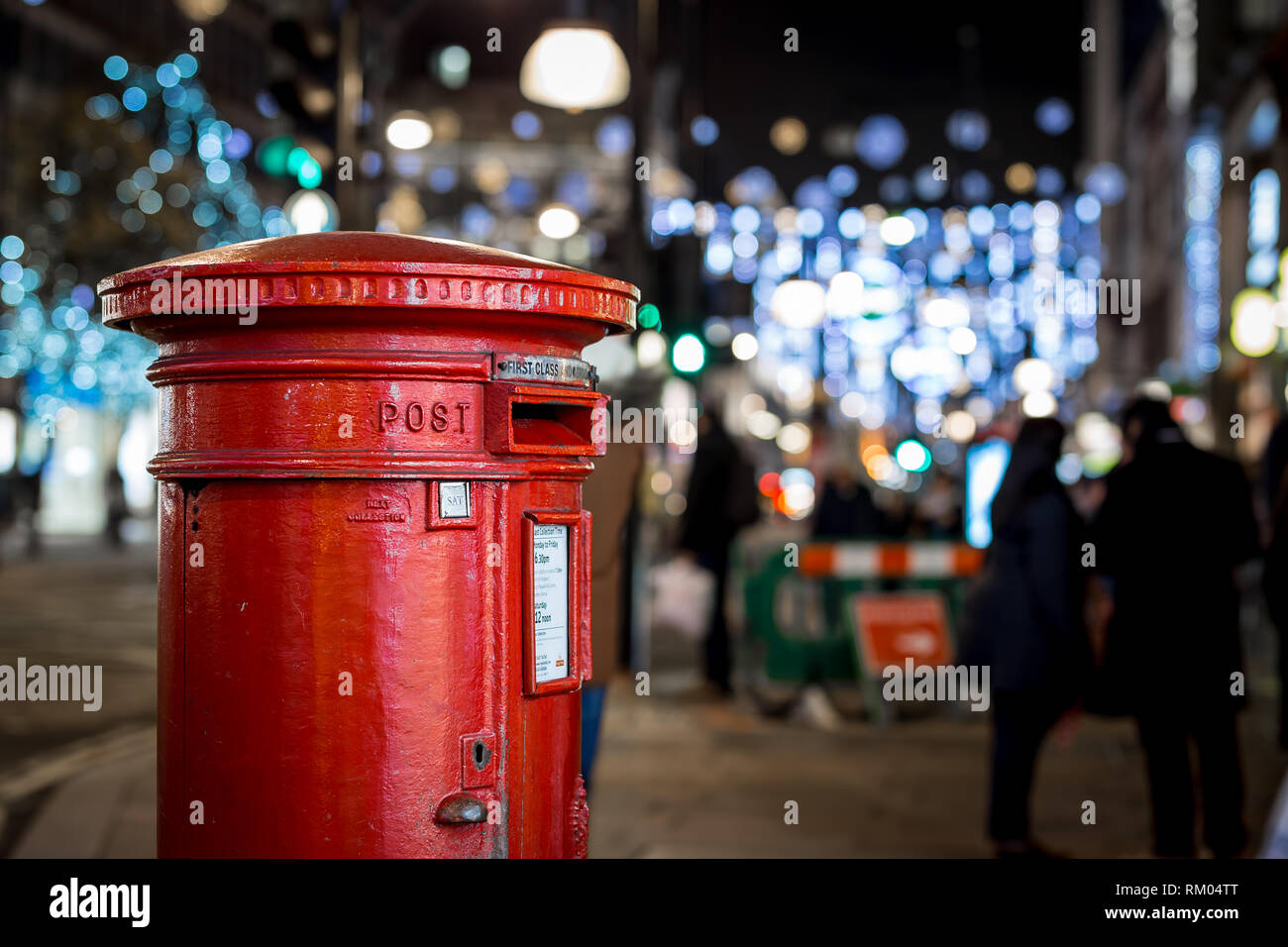 Classic London post box on the Oxford street in Christmas time Stock