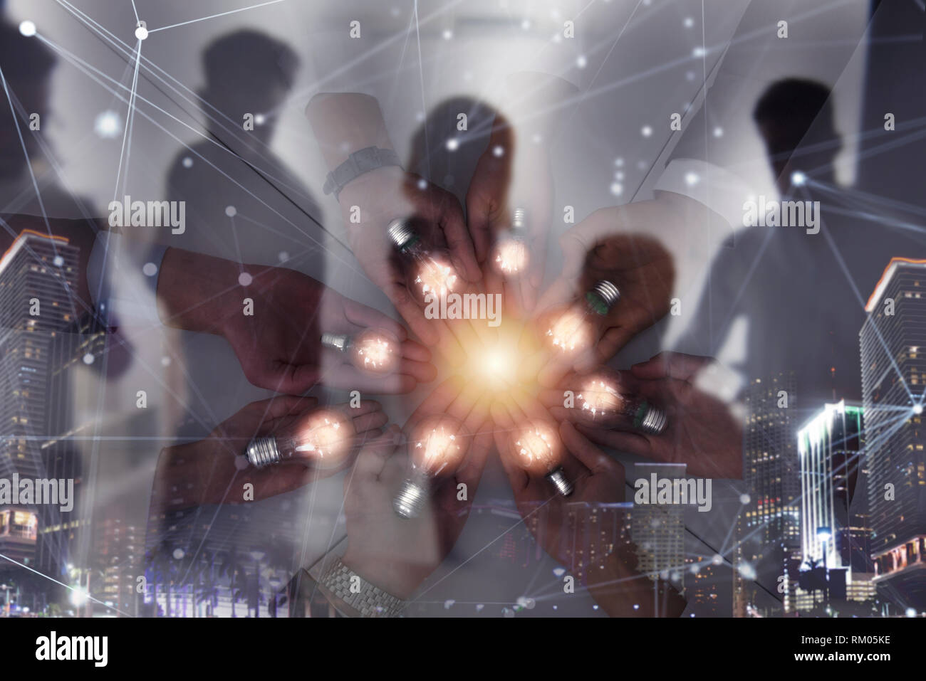 Teamwork and brainstorming concept with businessmen that share an idea with a lamp with network lines. Concept of startup. Double exposure Stock Photo