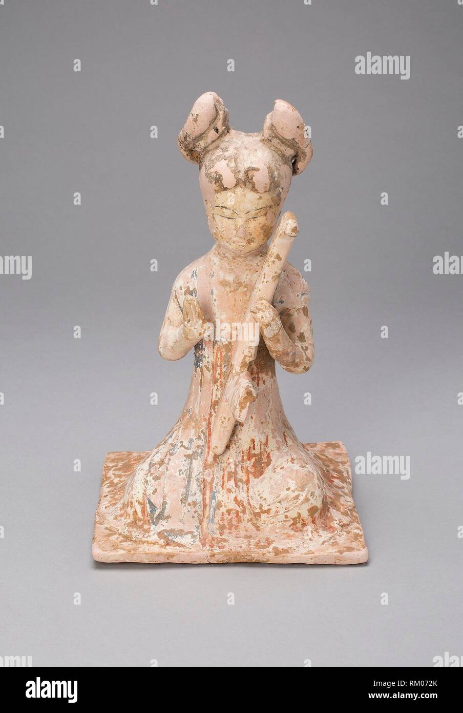 Female Musician - Tang dynasty (A.D. 618–907), late 7th/early 8th century - China - Origin: China, Date: 618 AD–906 AD, Medium: Earthenware with Stock Photo