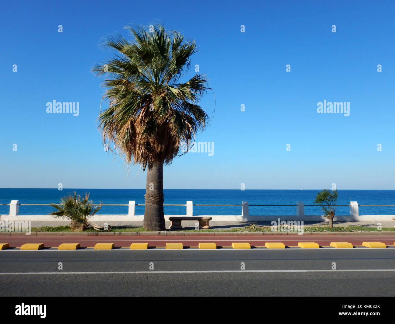 waterfront road and promenade on the beach with skyline and horizon of paola city cosenza calabria italy Stock Photo