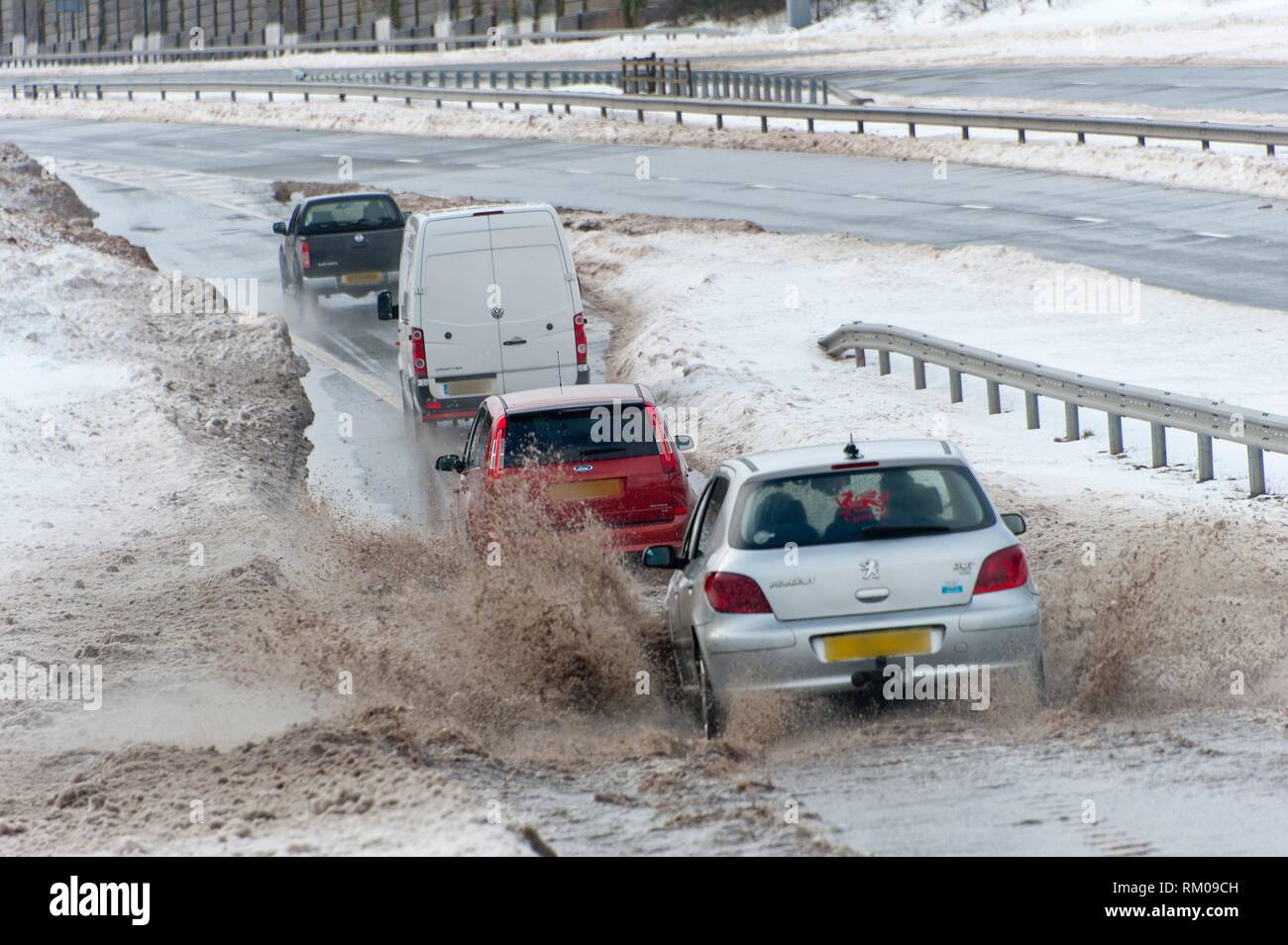 Tredegar, Blaenau Gwent, Wales, UK. 4th March, 2018. Vehicles negotiate