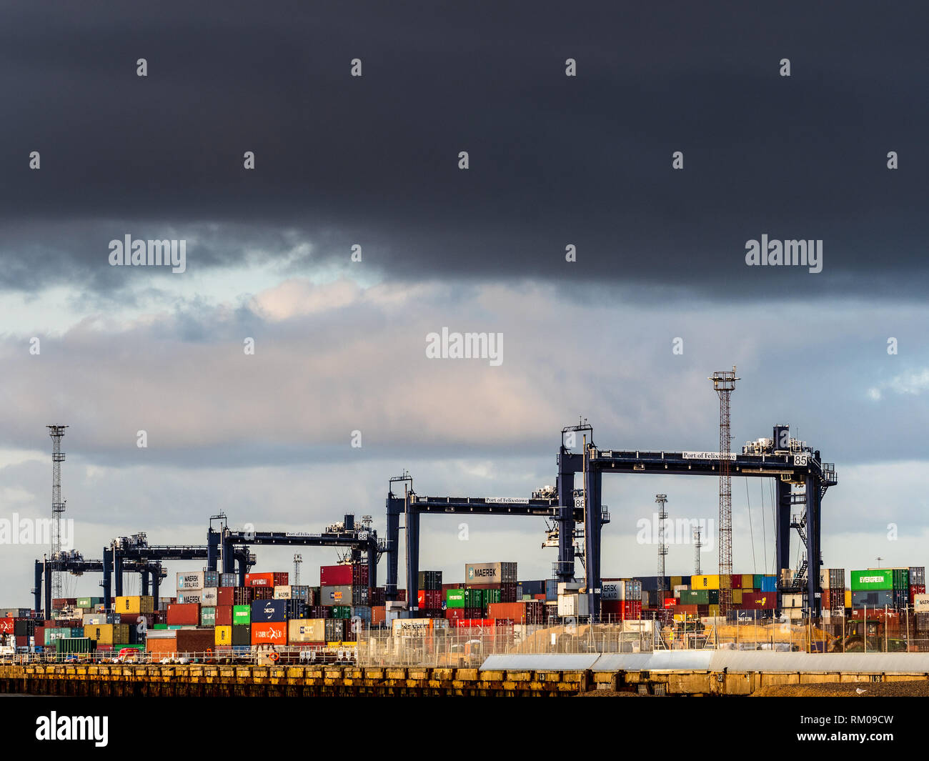 International Trade - containers being loaded and unloaded onto container ships at Felixstowe, the UK's main container port for imports and exports Stock Photo