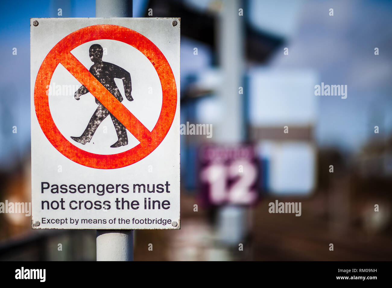 Railway Warning Sign - Passengers must not cross the line Stock Photo