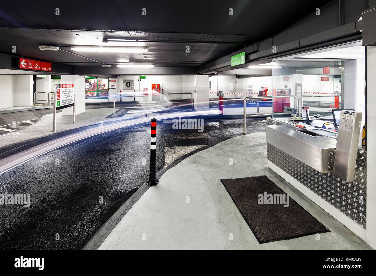 Light trails and the ticket office in the interior of QPark Eyre