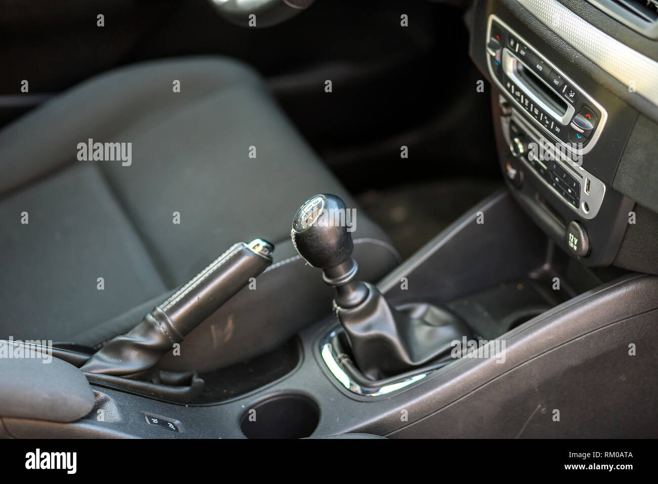 Luxurious car black leather interior. Handbrake manual brake and