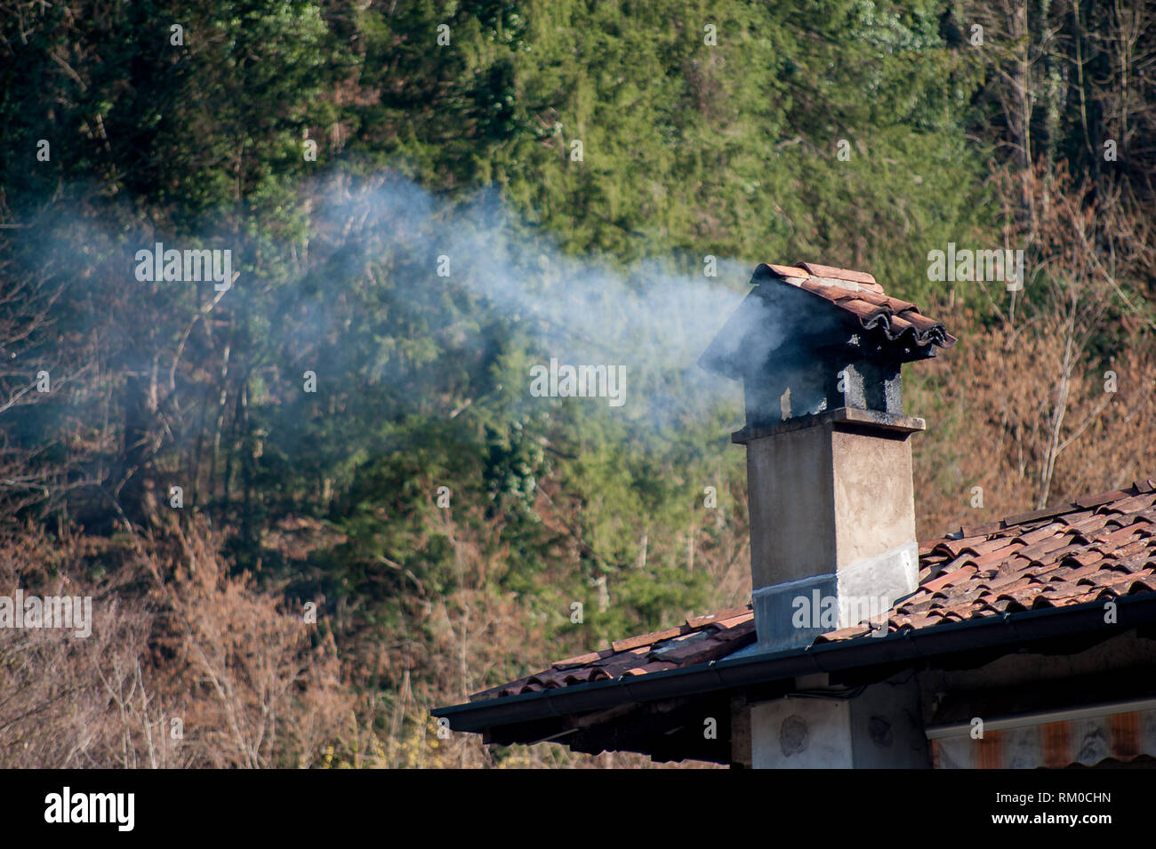chimney fuming by wood stove Stock Photo Alamy