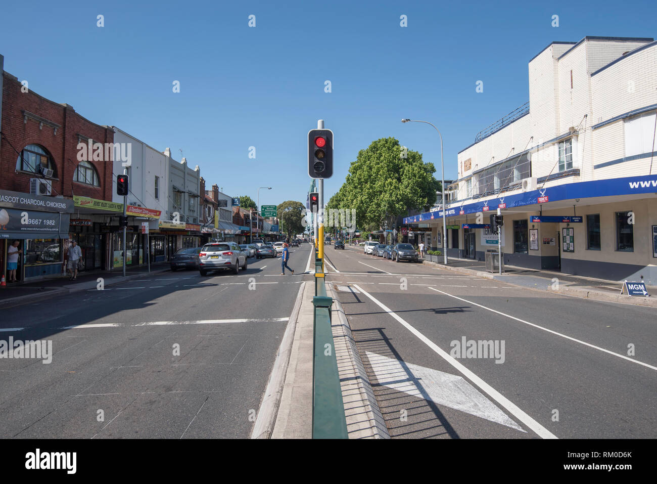A set of traffic lights and a level crossing on Botany Road in the shopping area of the Sydney suburb of Mascot Stock Photo