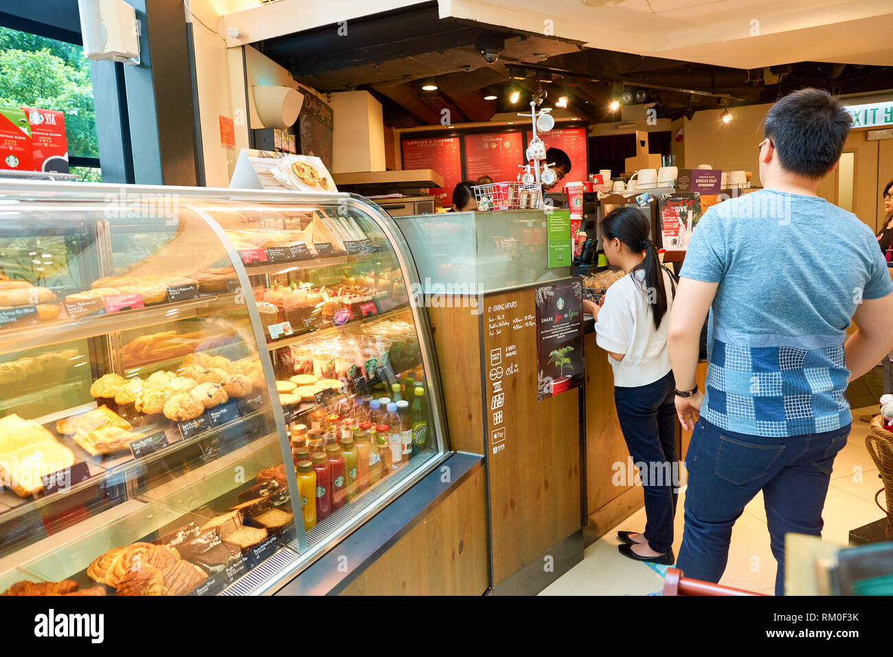 HONG KONG CIRCA NOVEMBER, 2016 people at a Starbucks cafe in Hong