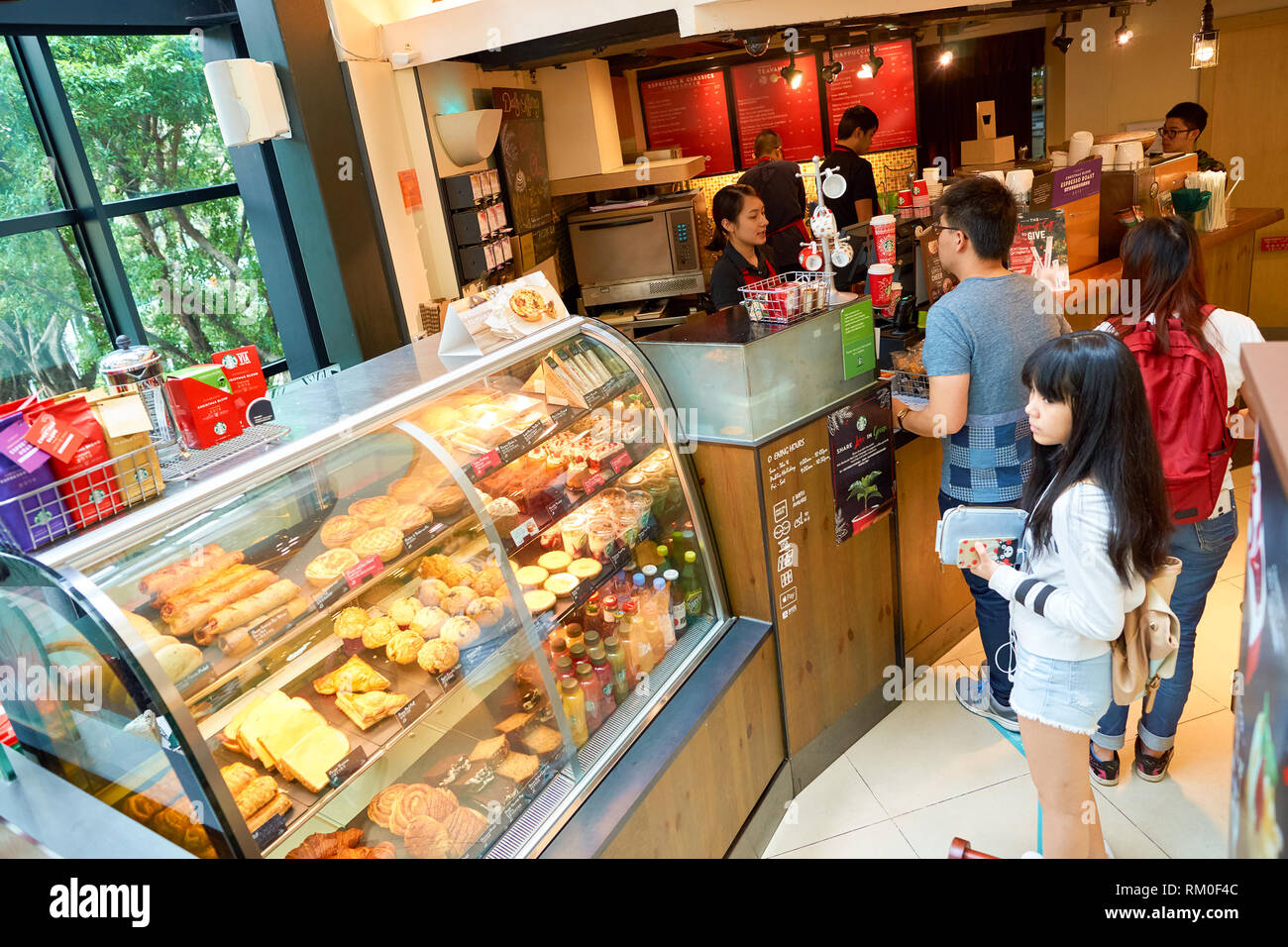 HONG KONG CIRCA NOVEMBER, 2016 people at a Starbucks cafe in Hong
