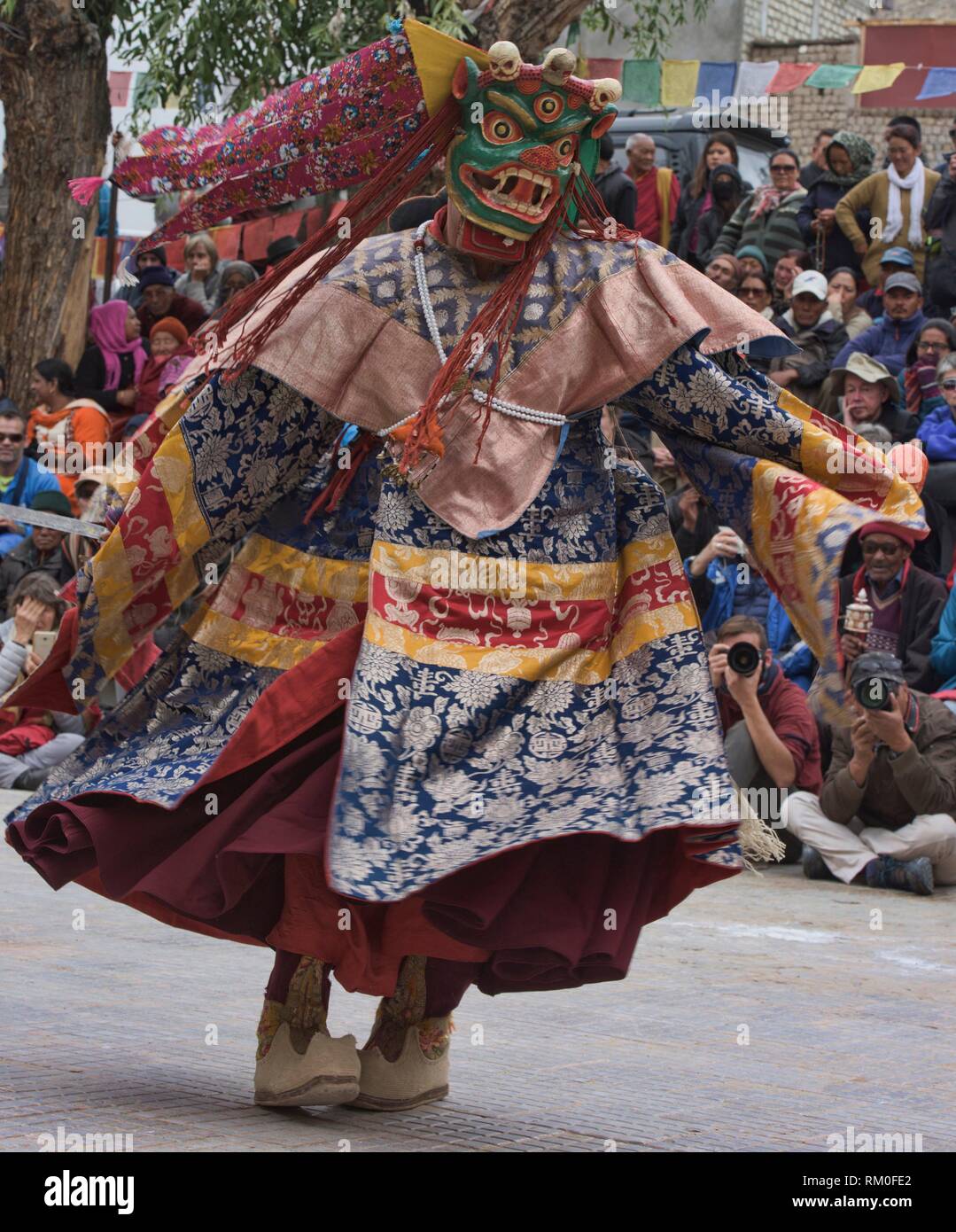 A masked monk dances at a traditional Tibetan Buddhist Cham dance , Leh ...