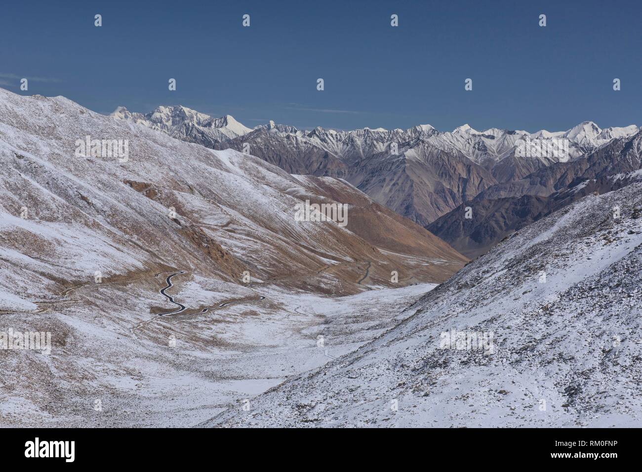 Snowbound Karakoram Mountains and the Nubra Valley seen from the Khardung La Pass, Ladakh, India. Stock Photo