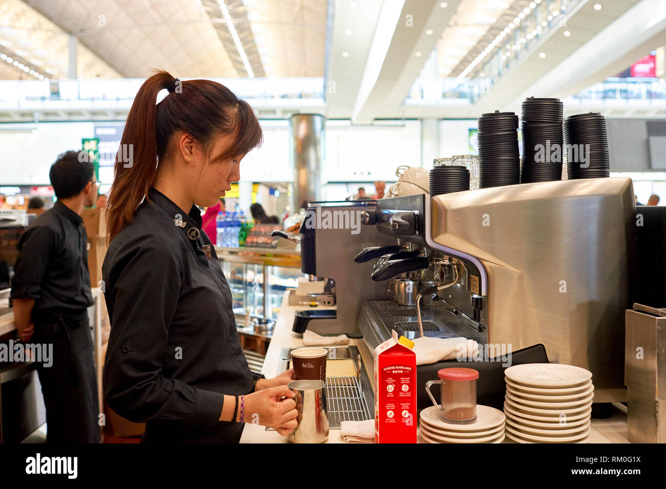Mccafe Worker HONG KONG - CIRCA NOVEMBER, 2016: barista prepare coffee at a McCafe in ...