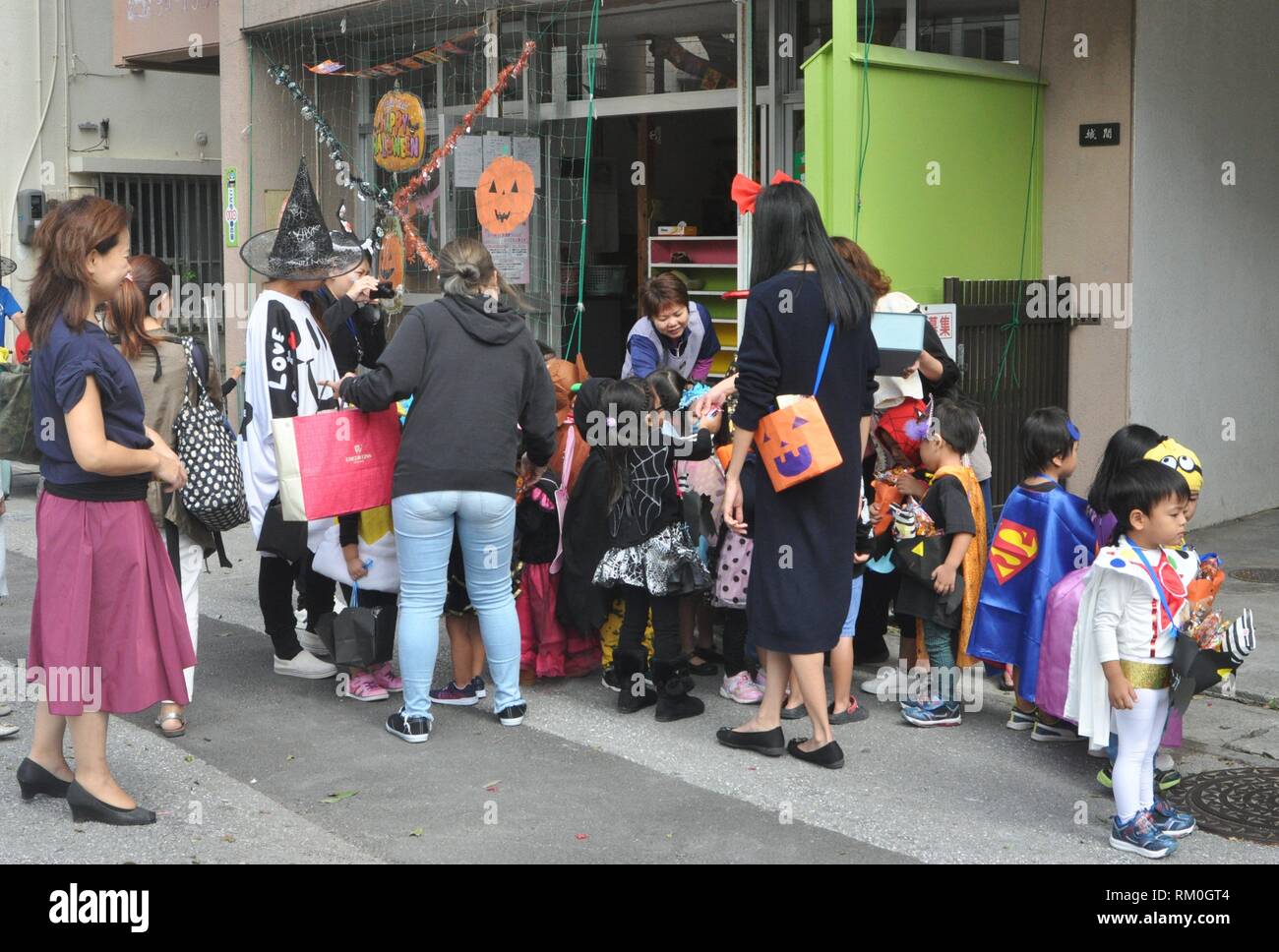 Naha, Okinawa, Japan: children dressed for Halloween in front of a kindergarten Stock Photo