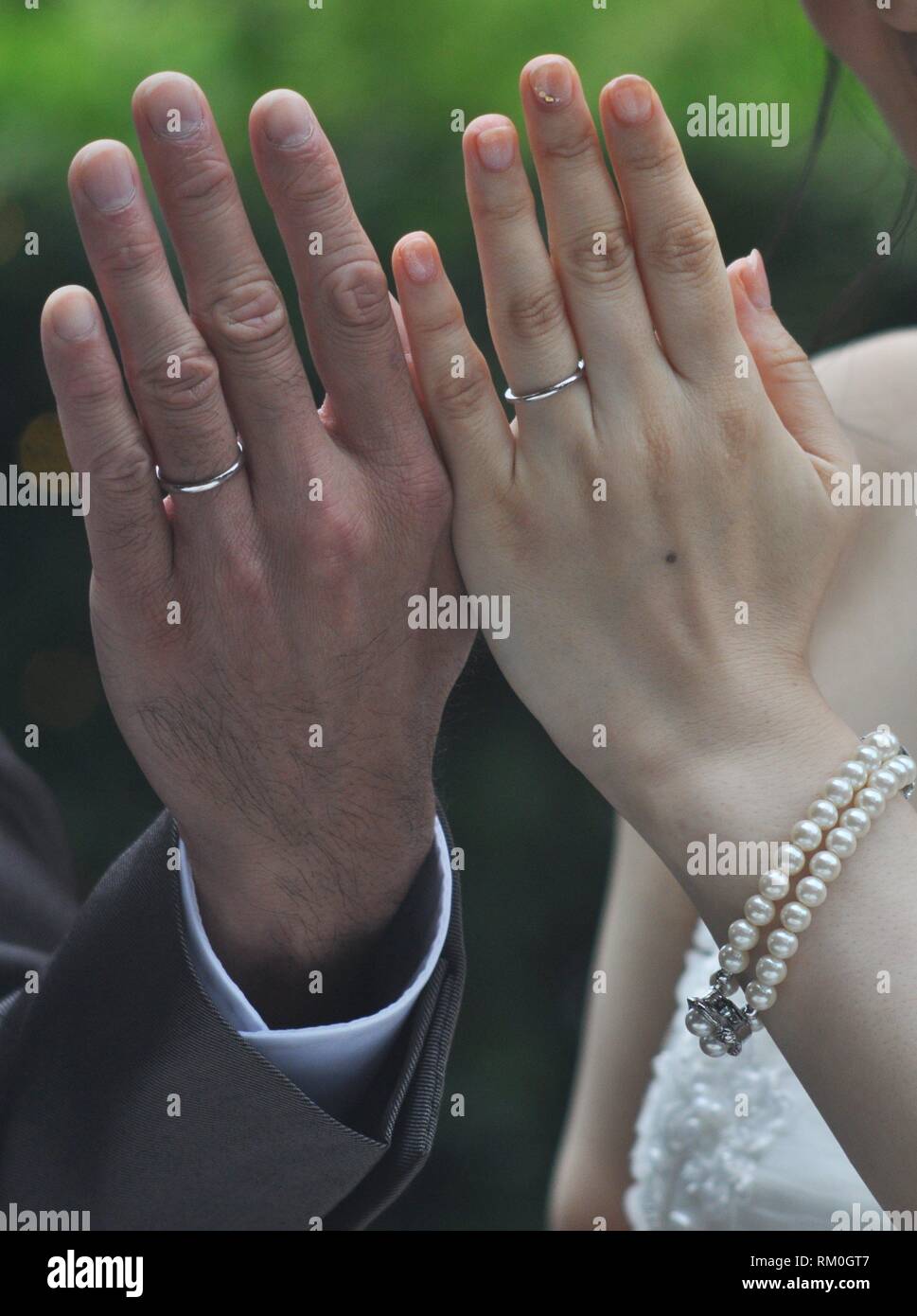 Yokohama, Japan: newlyweds showing their wedding rings during a wedding ceremony Stock Photo