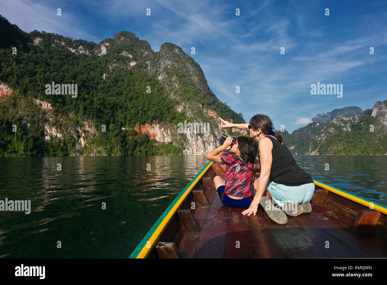 Visitors bird watch on CHEOW LAN LAKE in KHAO SOK NATIONAL PARK - THAILAND Stock Photo