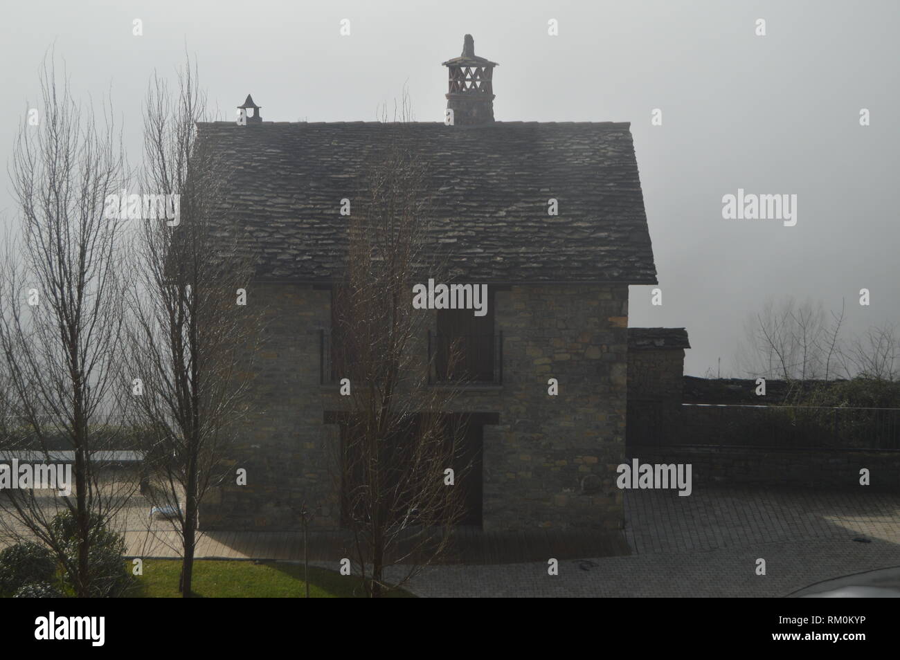 Beautiful Medieval Style Stone House With Black Slate Roofs In Ainsa Village. Travel, Landscapes, Architecture. December 26, 2014. Ainsa, Huesca, Arag Stock Photo