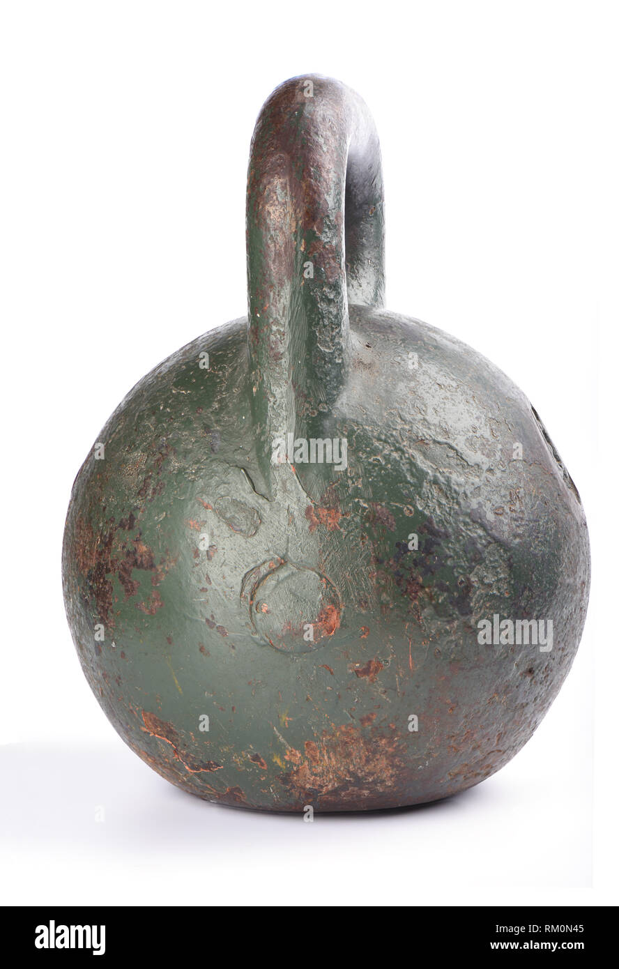Old rusty kettlebell for sports isolated on white background. Side view