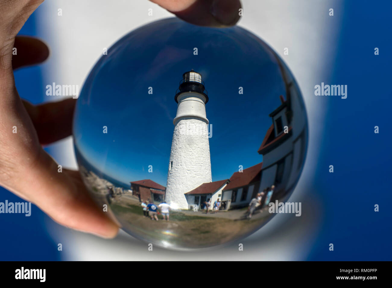 Lighthouse Ball A lighthouse in Maine seen through a glass ball Stock Photo - Alamy