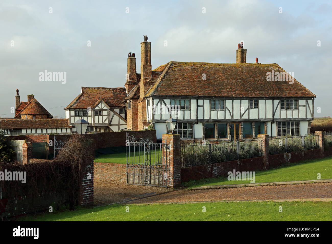 Kentlands, a unique Grade II listed Arts and Crafts house built from original Tudor materials, has been described as Britain's best beach house. Stock Photo
