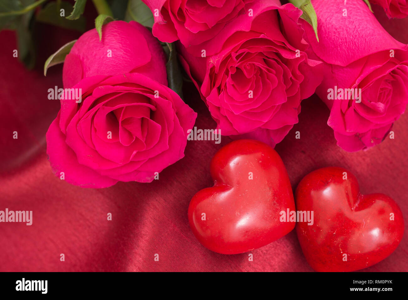 Two Roses Making A Heart Bouquet red roses hearts hi-res stock photography and images - Alamy