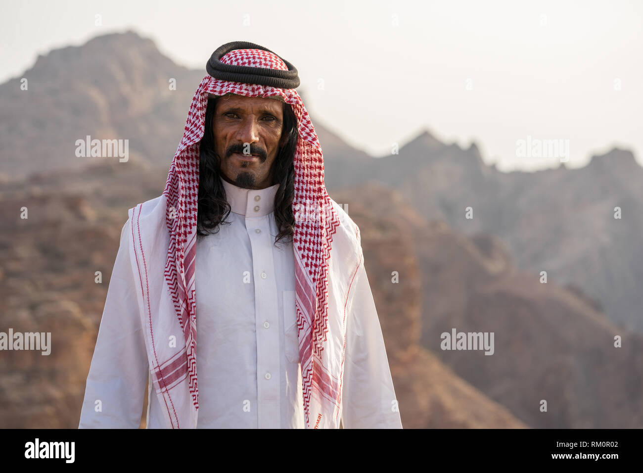 Warmth and hospitality shown through the face of this Bedouin man in the mountains of Jordan near Petra. Stock Photo