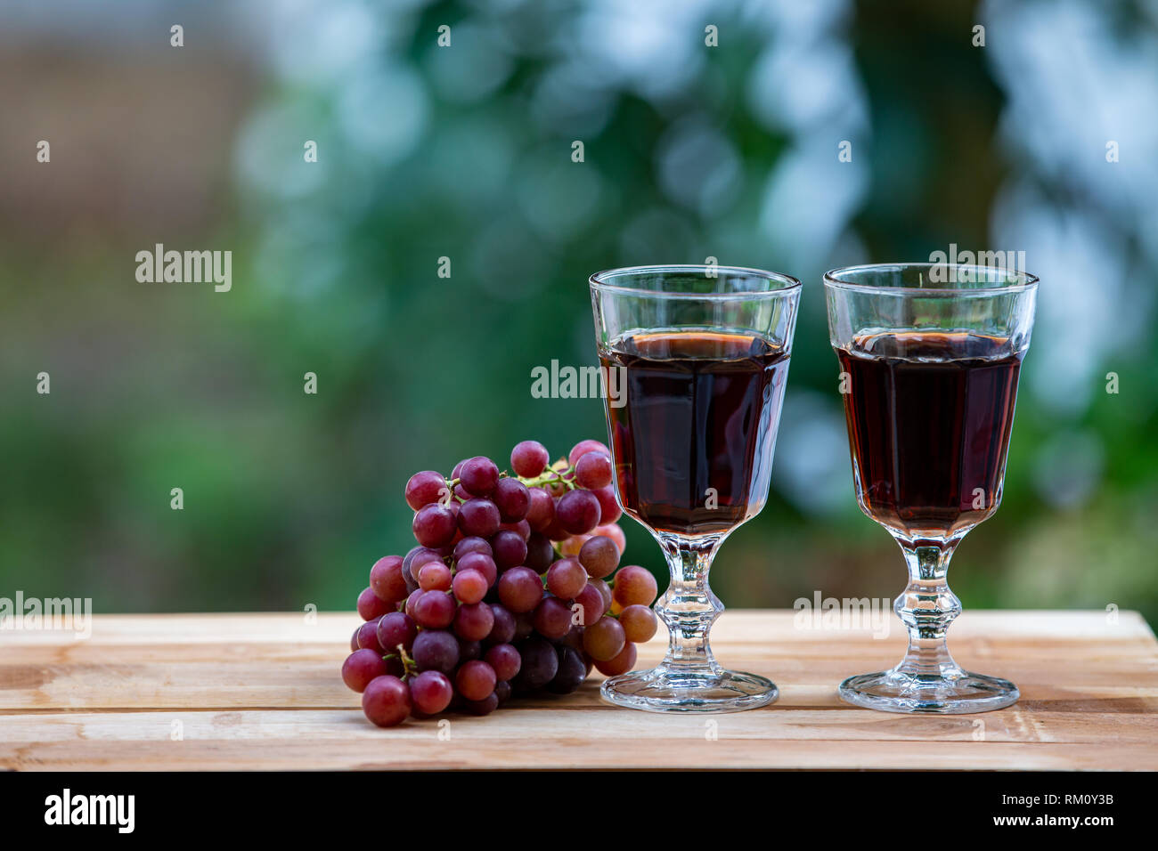 red wine and red grapes Stock Photo