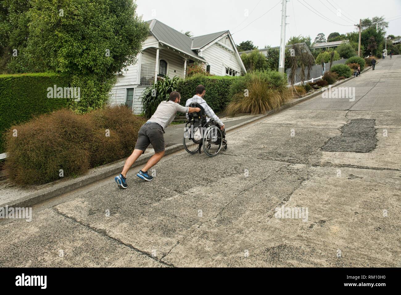 Wheelchair uphill hires stock photography and images Alamy