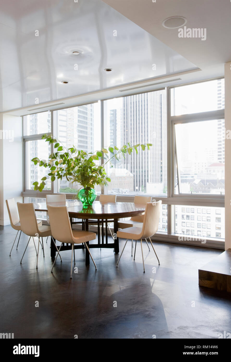 Dining room in luxury highrise apartment Stock Photo - Alamy