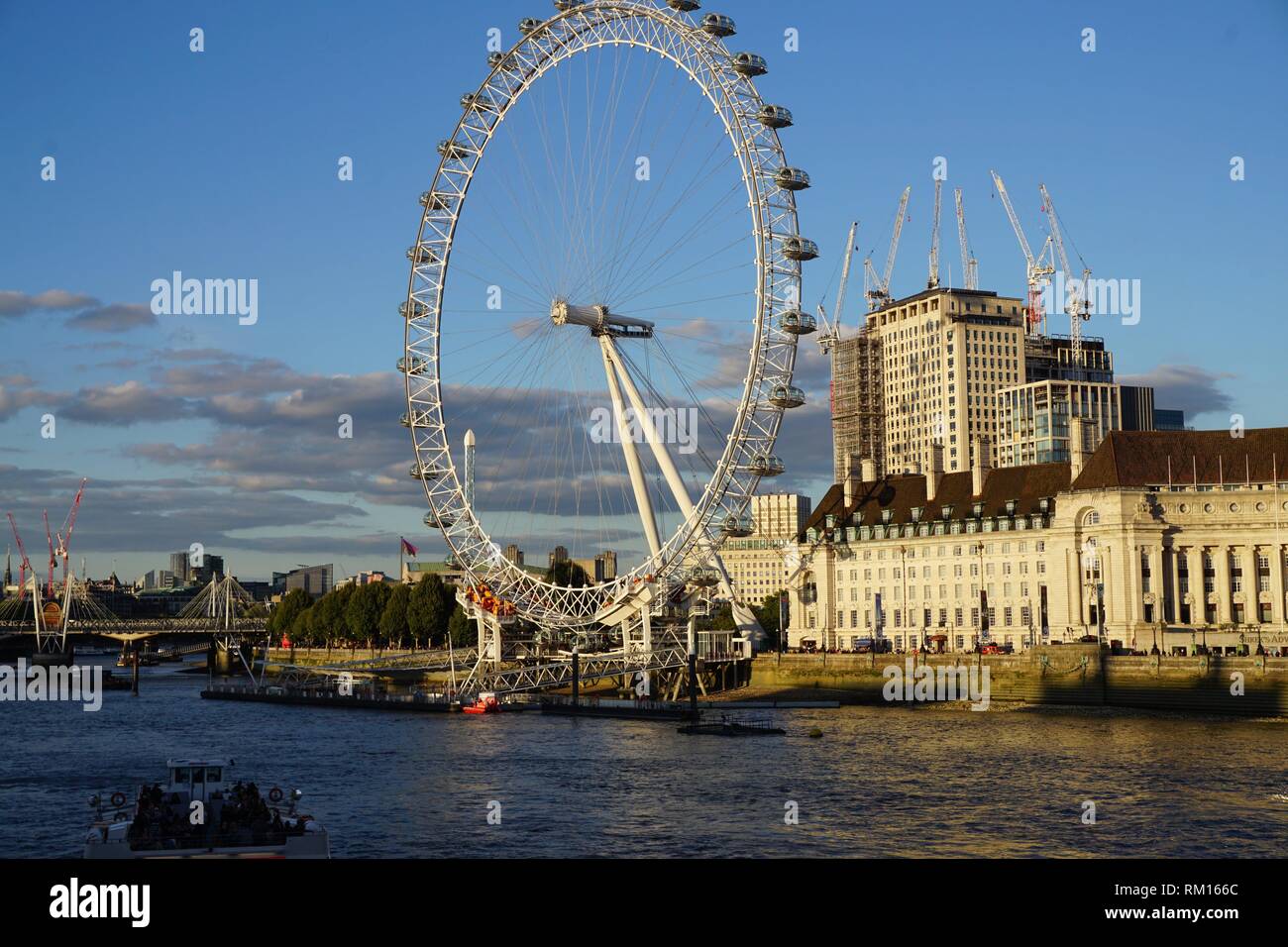 The London Eye and the County Hall on Queen's Walk. On the left, a view