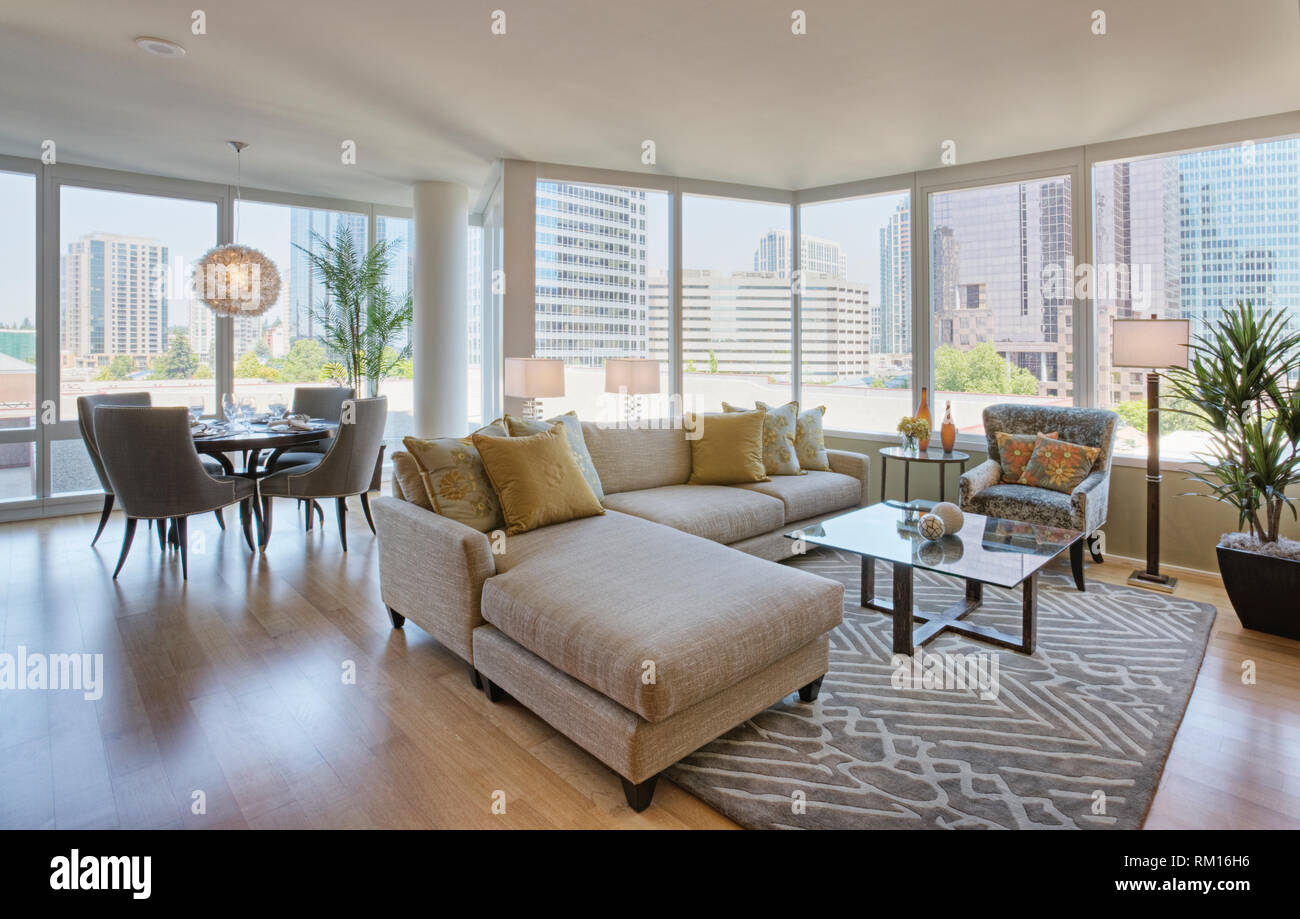 Living room and dining room in luxury highrise apartment Stock