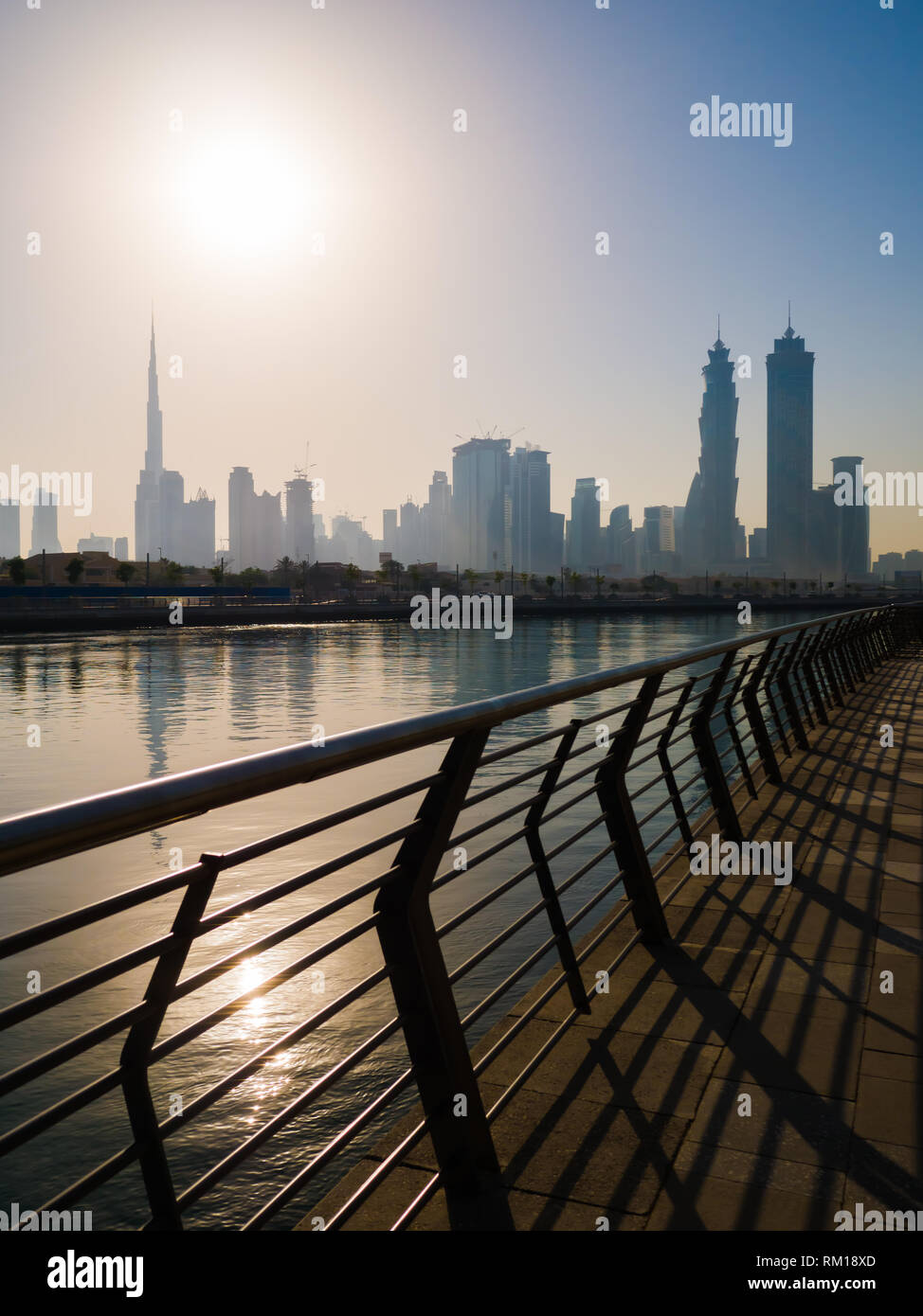 Panorama of the city of Dubai early in the morning at sunrise with a bridge over the city channel Dubai Greek. Stock Photo
