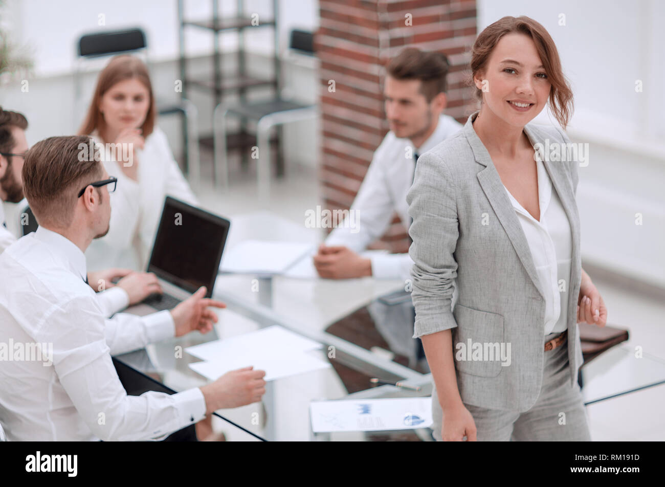young business woman standing in office Stock Photo - Alamy
