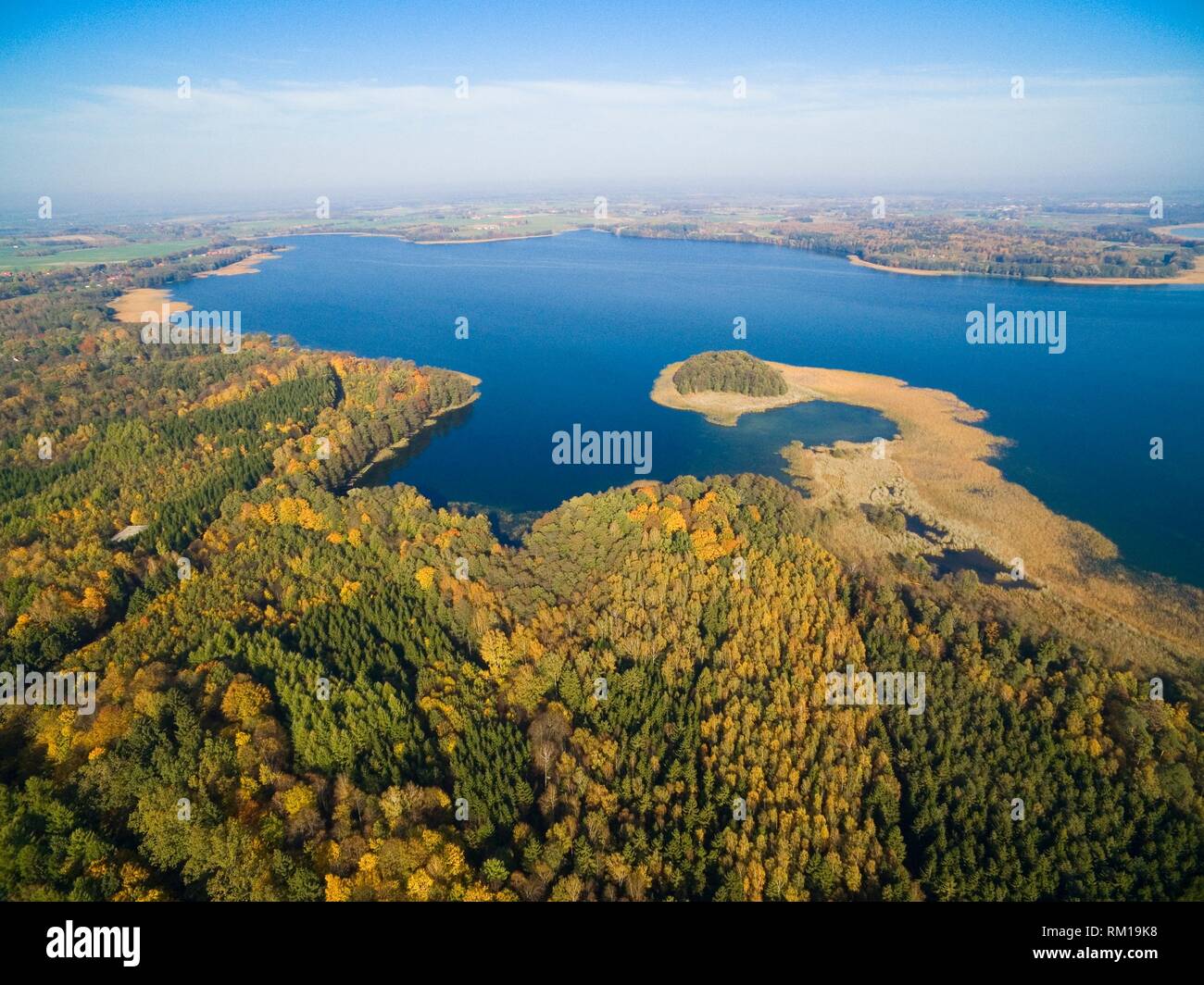 Aerial view of beautiful landscape of Mazury region during autumn season, Mamry Lake in the background, Poland Stock Photo