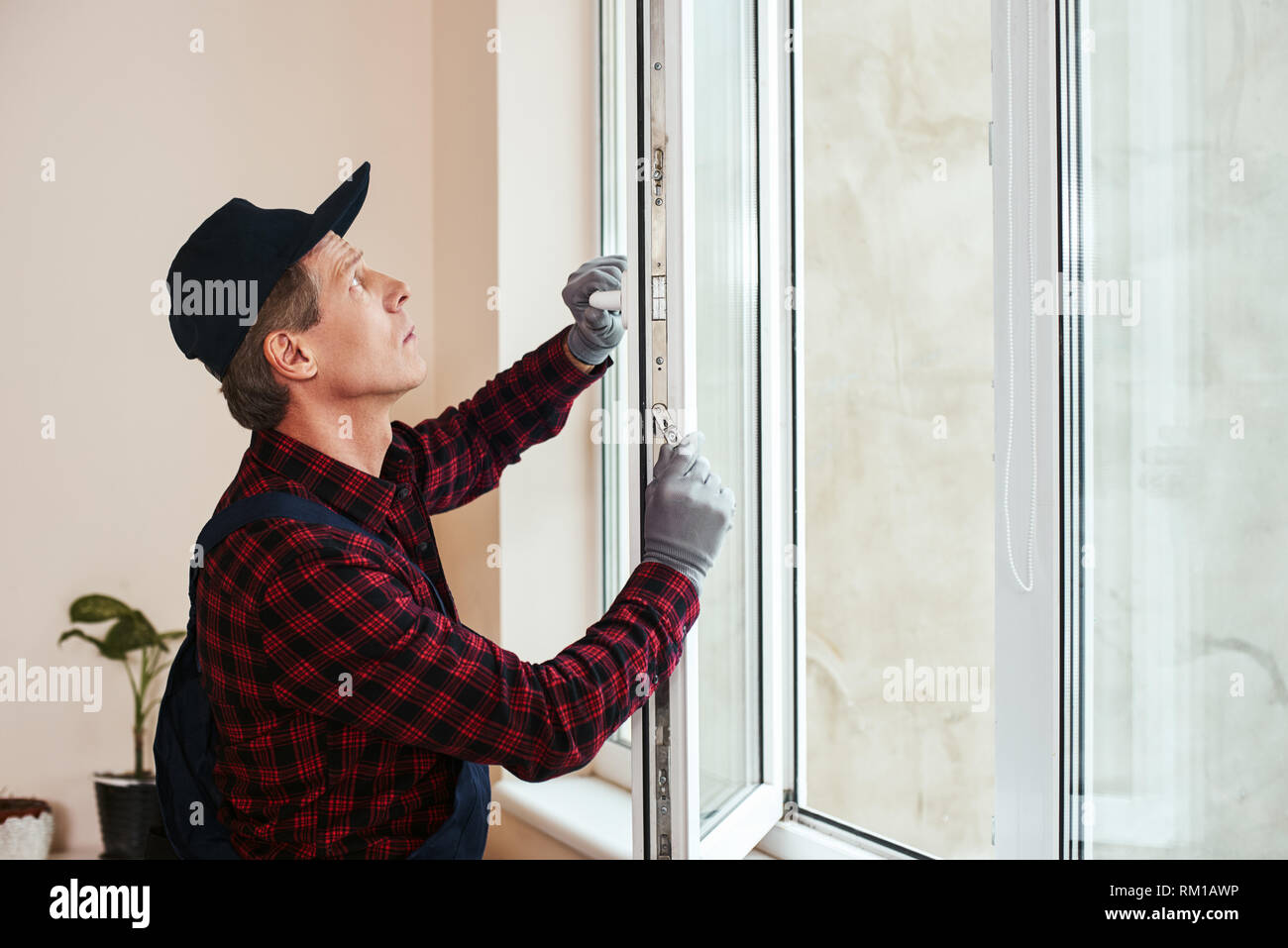You Will Hear Sound Of Quiet Senior Handyman Setting New Windows At The Appartment Stock Photo Alamy