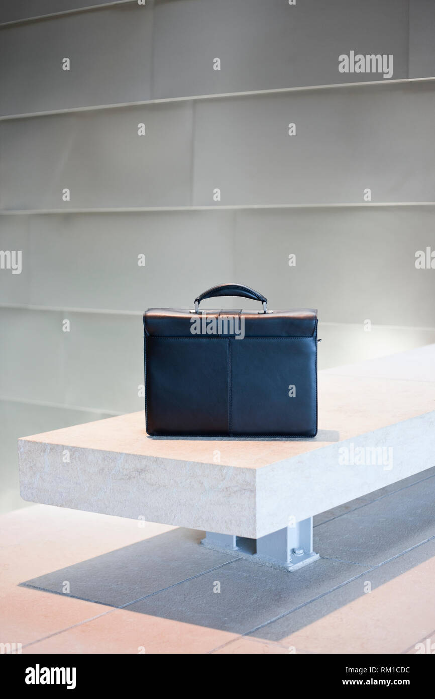Black Briefcase on White Stone Bench Stock Photo Alamy