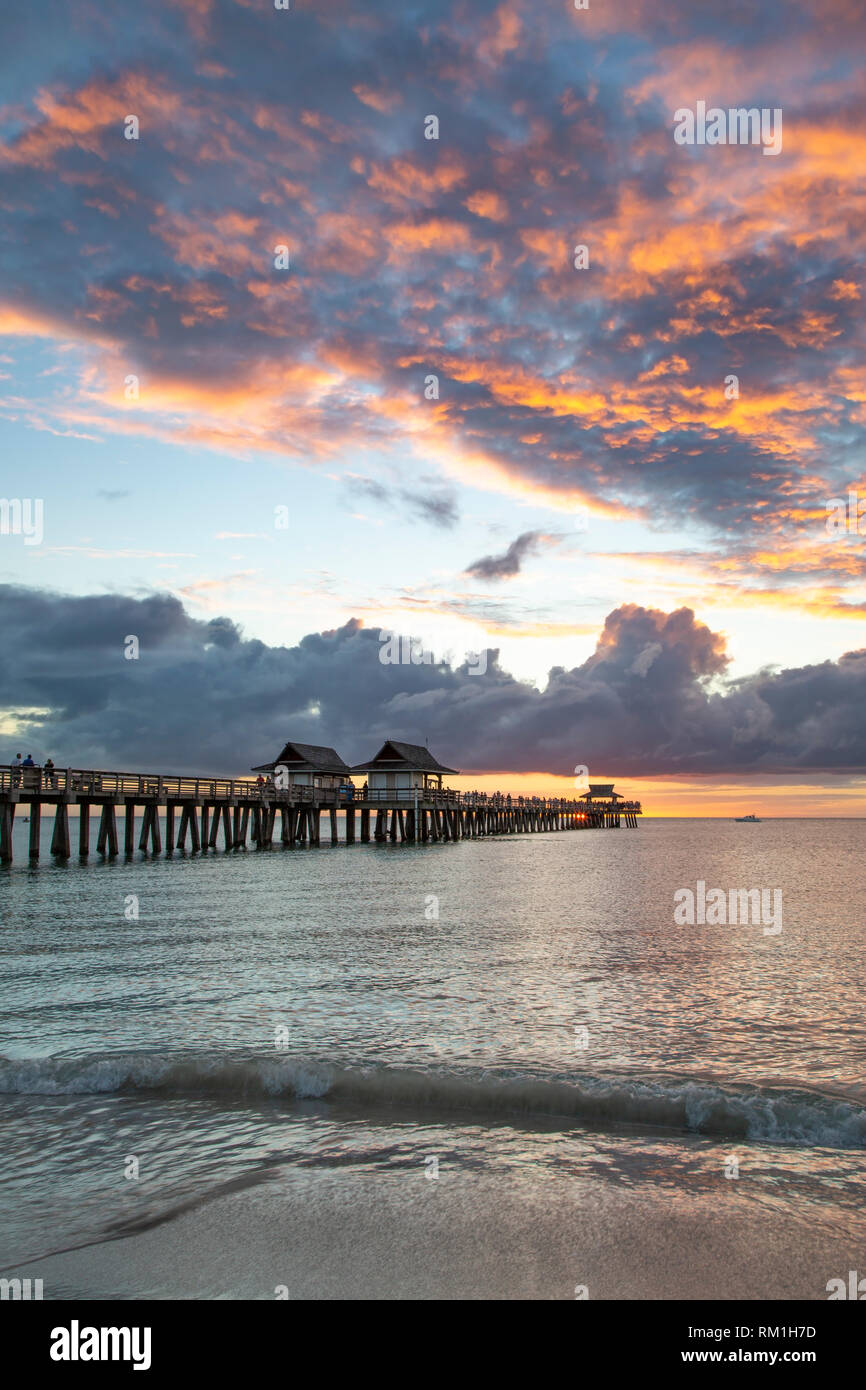 Sunset over the Gulf of Mexico at the Naples Pier along Florida's Gulf Coast, Naples, Florida, USA Stock Photo