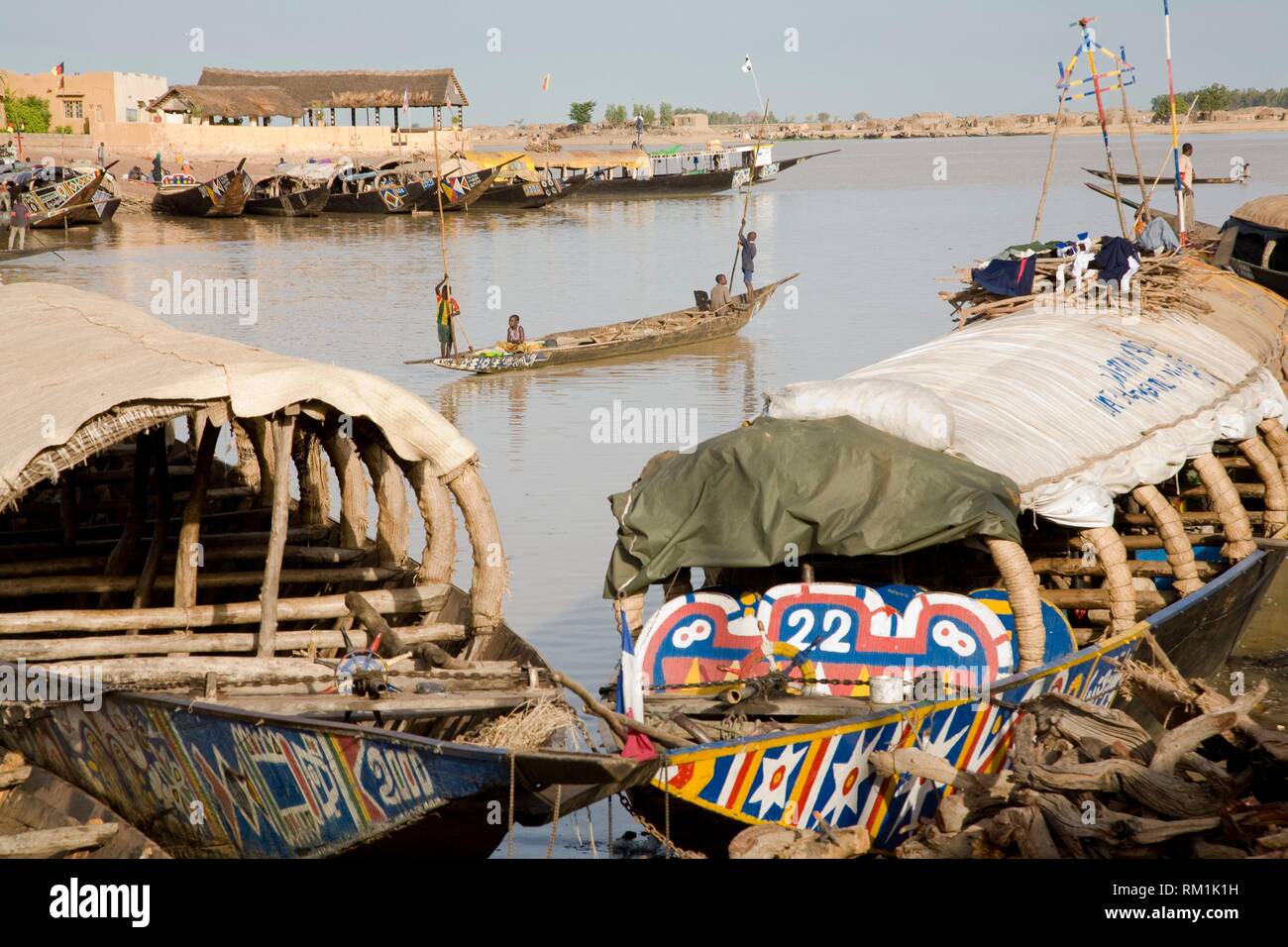 Pinnaces (traditional wooden boats) in the Port of Mopti, Mali. Some of them are the houses of fishermen´s families of Bozo ethnic group. Stock Photo