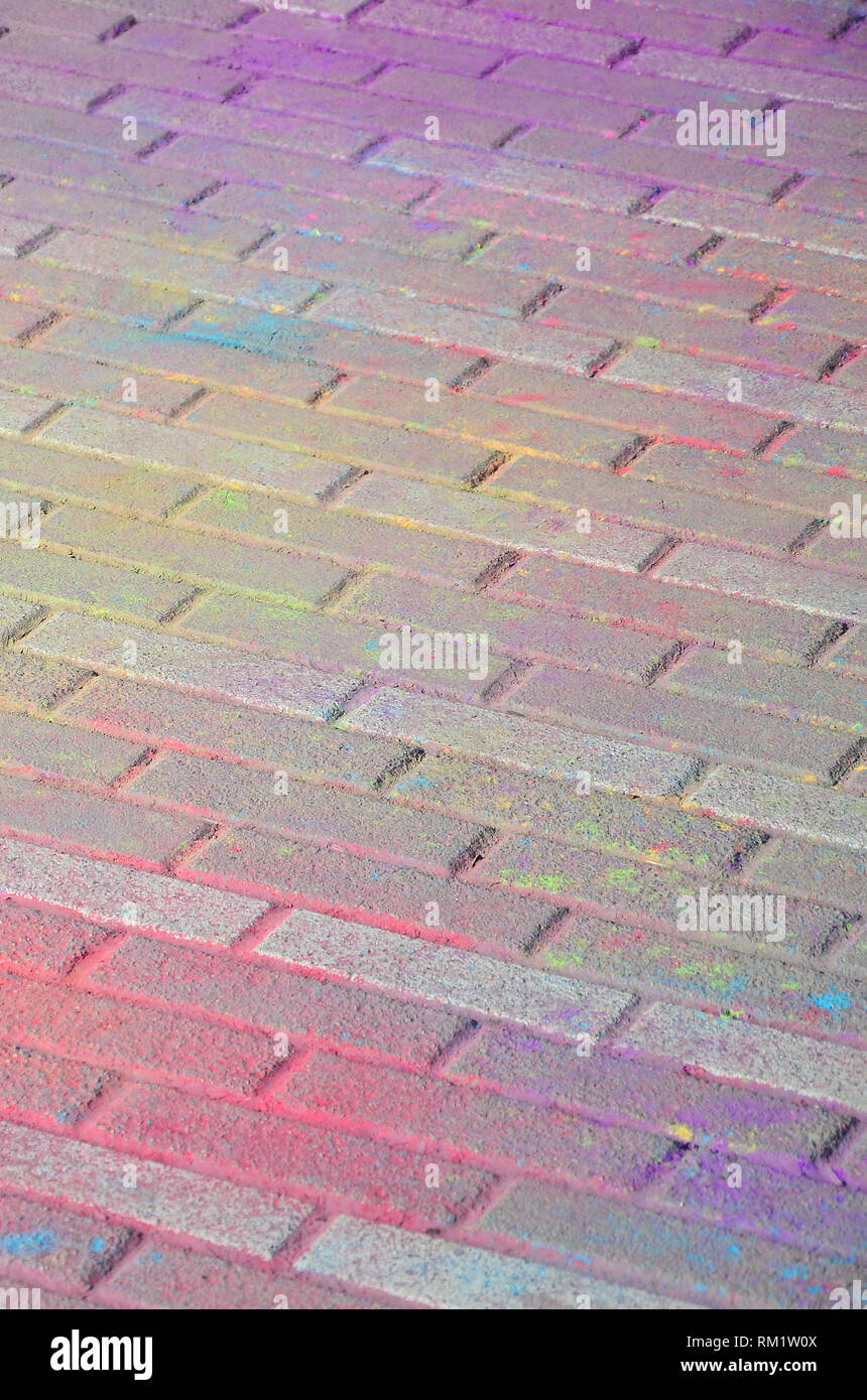 Multi colored earth, paving slabs, powder coated with dry colors at the ...